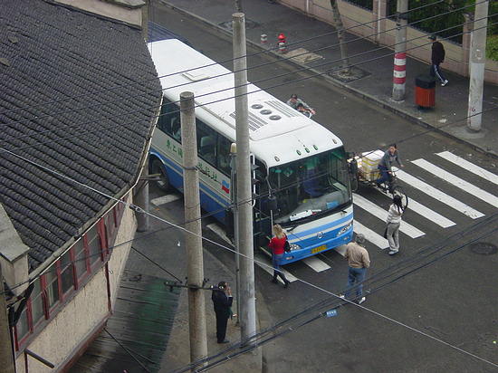 Tricycle versus Bus